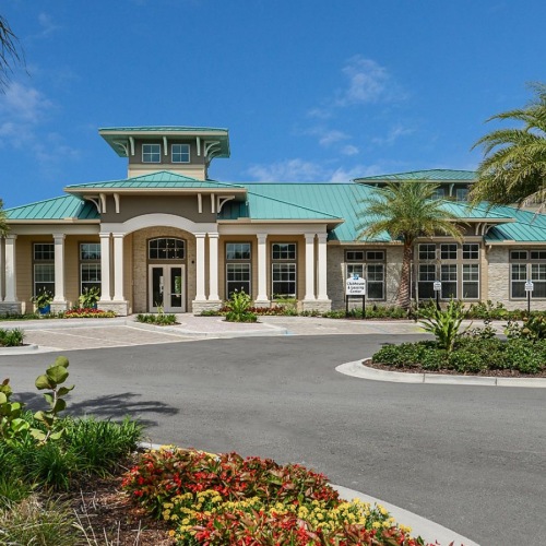 the leasing office with palm trees