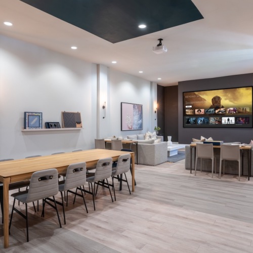 a community movie theater with a table and chairs