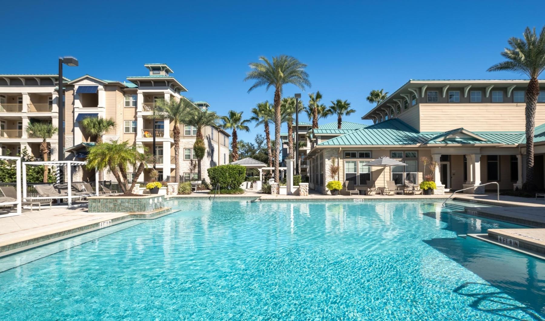 a swimming pool in front of a building
