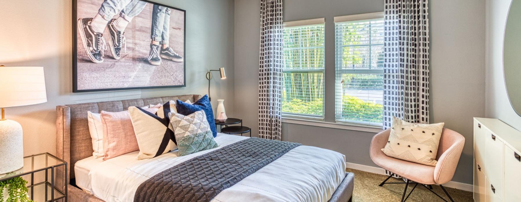 a bedroom with a large window