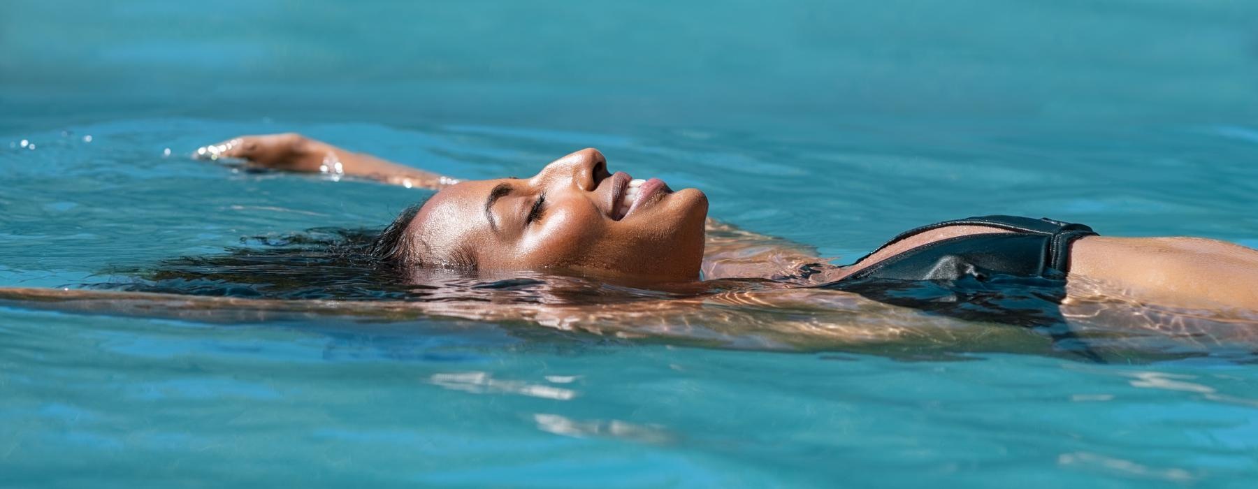 a hippo swimming in water
